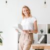 smiling-businesswoman-holding-folder-1.jpg